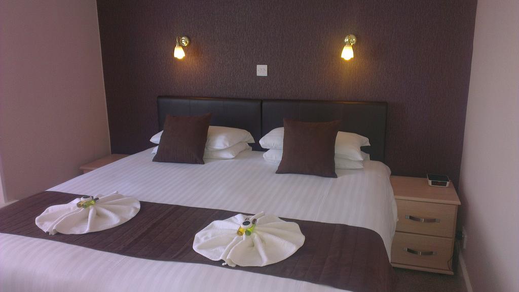 Wayside Cheer Hotel Castel ห้อง รูปภาพ